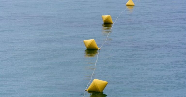 Line Following - A row of yellow buoy floating in the water
