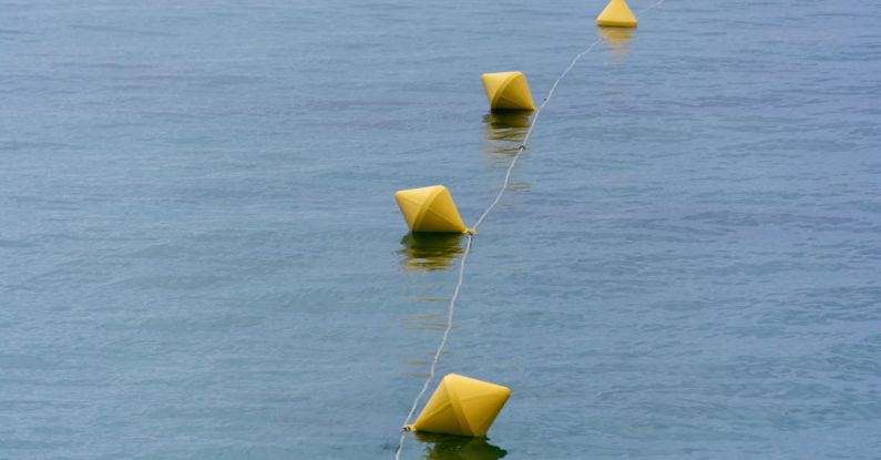 Line Following - A row of yellow buoy floating in the water