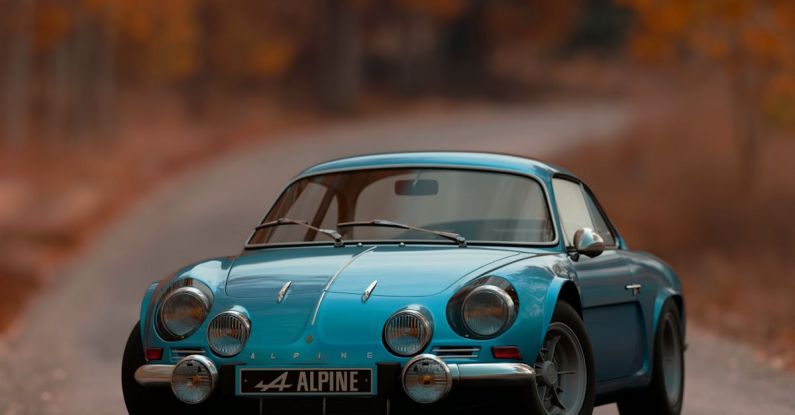 Wheeled Vs Tracked - Shallow Focus Photography of Blue Alpine Car