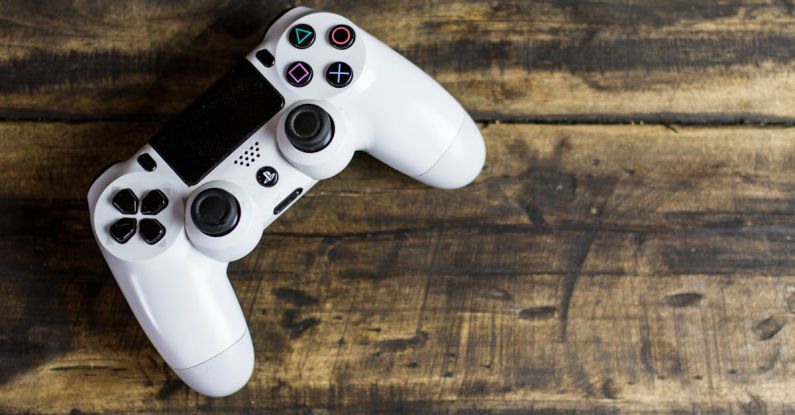 Controller - White Gaming Console on Wooden Surface