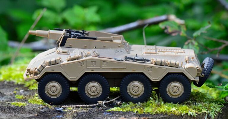 Tank - Tan Military Artillery Vehicle Toy on Wood Stump