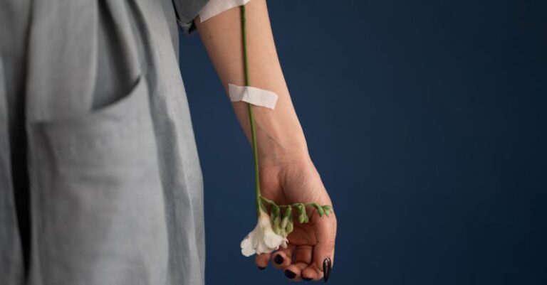 Arm Attachments - Crop unrecognizable woman with flower attached to arm with plaster